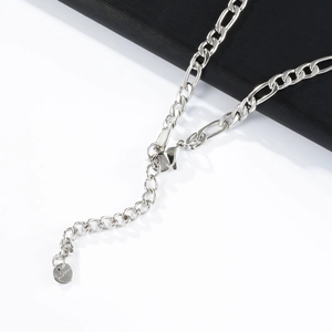 Detail view of silver stainless steel necklace with lobster clasp and adjustable figaro chain
