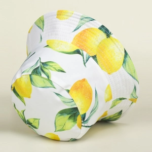White canvas bucket hat with fresh yellow lemon print for summer sun protection