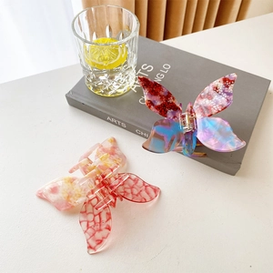 Elegant acetate butterfly hair claw clips in colorful spotted and red checkered patterns