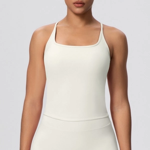 Close-up of cream yoga camisole with thin straps and a minimalist square neckline
