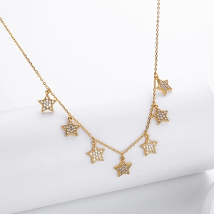 Elegant gold S925 silver necklace with seven star pendants and white zircon pavé setting