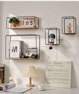 Detail of Nordic wall-mounted metal and wood shelves in a modern home office setting