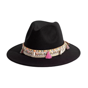 Classic black felt wide brim fedora hat featuring colorful woven band with shells and tassels