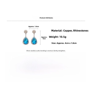 Detailed specs of teardrop blue rhinestone earrings with silver pins and floral stud detail