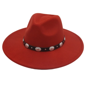 Detail of red wide brim felt fedora hat featuring black leather band with silver metal studs