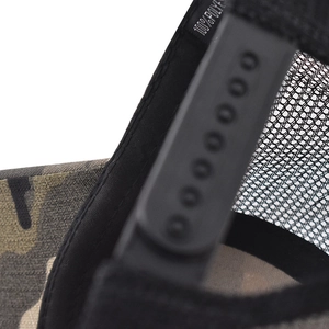 Detail of camouflage baseball cap showing breathable mesh and adjustable snapback closure