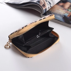 Detailed interior of leopard print zip wallet showing multiple card slots and black lining