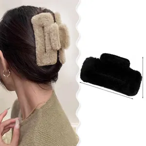 Detail view of large plush hair claw clips with specific dimensions for women hair accessories