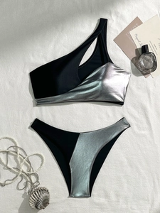 One-shoulder black and silver bikini set with geometric cut-out and metallic finish