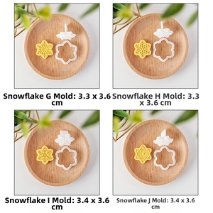 Detail view of four mini snowflake cookie cutters and embossers for Christmas baking