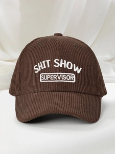 Detailed close-up of white embroidery on dark brown corduroy baseball cap fabric