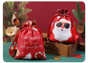 Detail of red polyester Christmas drawstring gift bags featuring Santa Claus graphics