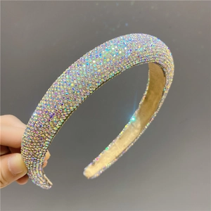 Close-up of sparkling AB rhinestones on a padded headband with detailed craftsmanship