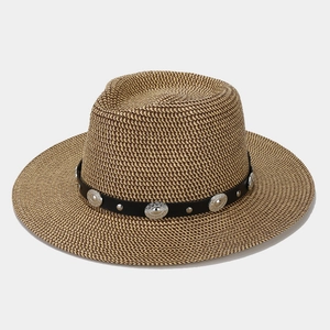 Straw cowboy hat with black leather band and bohemian silver metal studs for sun protection
