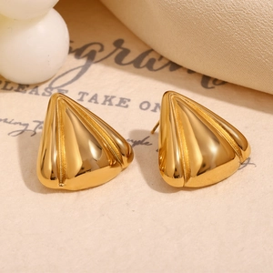 Macro shot of 18K gold plated geometric triangular stud earrings with high mirror polish