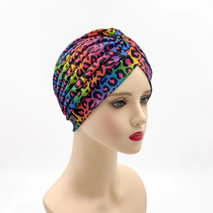 Colorful leopard print turban hat for women with pleated design and stretch knit fabric