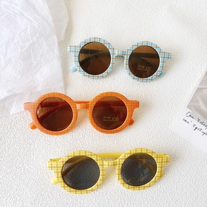 Three pairs of UV400 round checkered kids sunglasses in blue, orange, and yellow colors