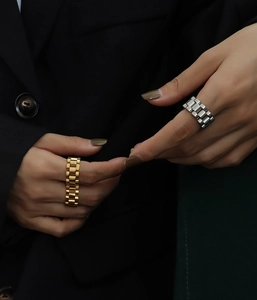 Detailed view of chunky gold and silver presidential link style stainless steel rings