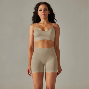 Detail of khaki seamless knit yoga set featuring v-neck camisole and high-waist shorts