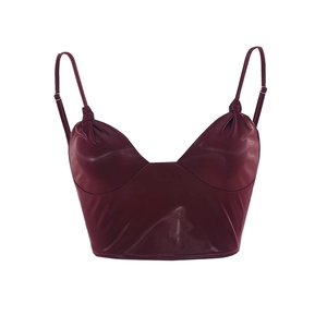 Detailed close-up of wine red PU leather crop top with glossy finish and thin straps