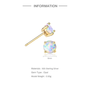 Detail of 6mm round opal earrings set in 925 sterling silver with a gold finish