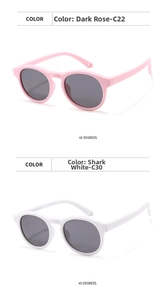 Detail view of round frame silicone kids sunglasses in dark rose and shark white colors
