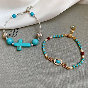Vintage style turquoise beaded bracelets with pearls and silver cross charm for women