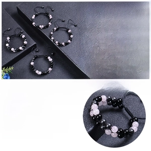 Detail of 8mm rose quartz and obsidian triple protection bracelet with adjustable cord
