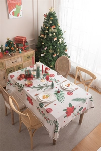 Detailed Christmas tablecloth featuring poinsettia prints, pine branches and fringe edges