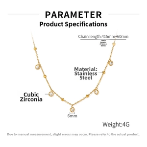 Detailed close-up of gold stainless steel necklace with five cubic zirconia pendants