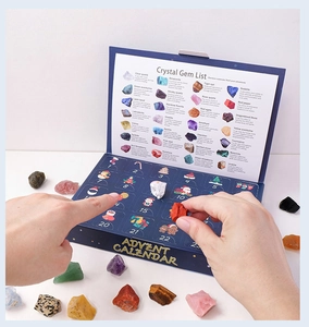 Macro shot of opening a Christmas Advent Calendar with 24 natural crystal stones and gems