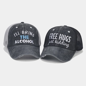 Close-up of distressed charcoal trucker hats with vintage embroidery and mesh back