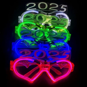 Close-up of five stacked 2025 LED glowing party glasses in white green blue and pink