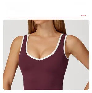 Detail of V-neckline with white trim on a tight-fit dark burgundy sports vest