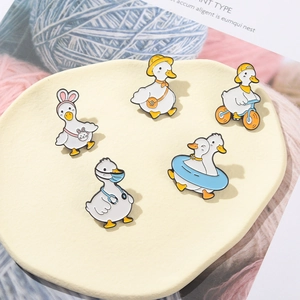 Set of 5 cute cartoon duck enamel pins in various sports and work outfits for jackets