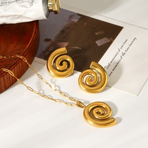 Detailed view of 18k gold-plated spiral pendant necklace and matching stud earrings