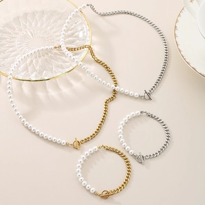 Elegant gold and silver titanium steel pearl necklace and bracelet set with OT clasp