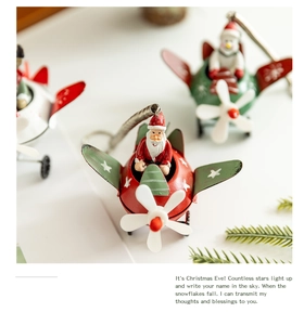 Close-up of Santa and Snowman metal airplane ornaments with festive spring hangers