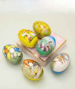 Set of six colorful Easter tin egg boxes with vintage rabbit and chick patterns