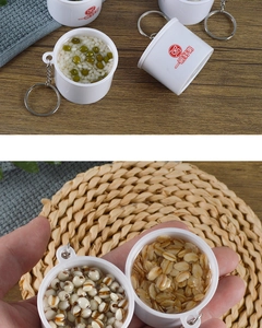Macro detail of realistic miniature mixed cereal bowl keychain with metal ring