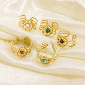 French vintage sunburst open rings set with colorful gemstones on gold silk background