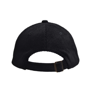 Detail view of the black corduroy baseball cap featuring an adjustable bronze metal buckle