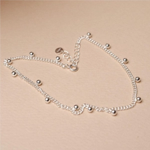 Minimalist S925 sterling silver bead chain anklet with round silver spheres on beige backdrop