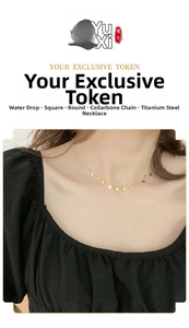 Golden titanium steel necklace with water drop and geometric charms on a model