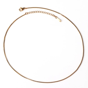 Detail of gold stainless steel box chain necklace with lobster clasp and extension