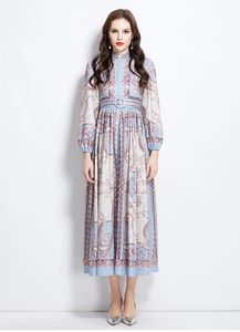 Close-up of European retro floral print and standing collar on a long blue dress