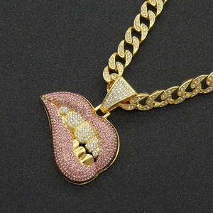Close-up of hip hop style Cuban chain with pink diamond lip and cigarette pendant