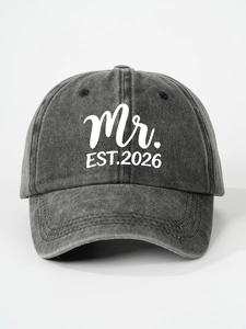 Detail of grey washed cotton baseball cap with white Mr. EST.2026 printed lettering