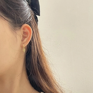 Minimalist S925 silver gold-plated cross dangle hoop earrings worn on a model ear
