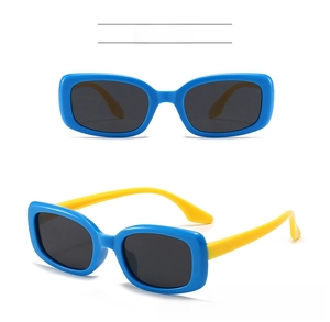 Detail view of children's square polarized sunglasses in blue and yellow contrast colors
